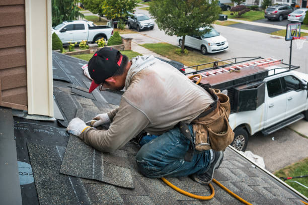 Professional Roofing technician working in Garden City, NY